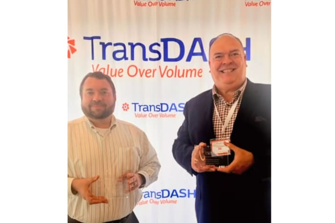 VIA Metropolitan Transit CEO Jon Gary Herrara and Chief of Staff Leroy Alloway accept awards for best in Customer Experience and Financial Stability.