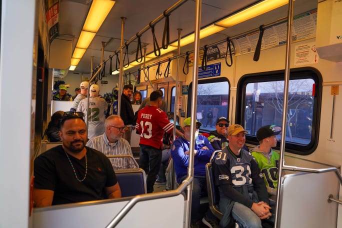 Football fans on VTA light rail vehicle.