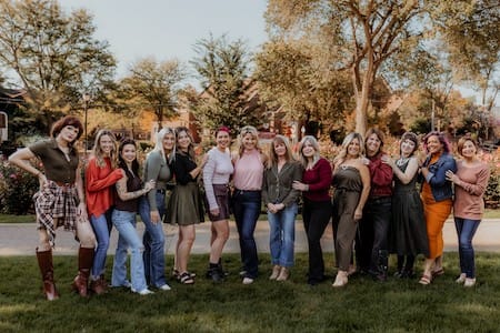 Owner Shelly Malizola and her team from Allure Designs in Beauty post outside.