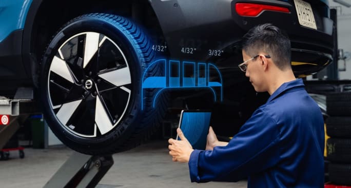 Technician using tablet to view tire data