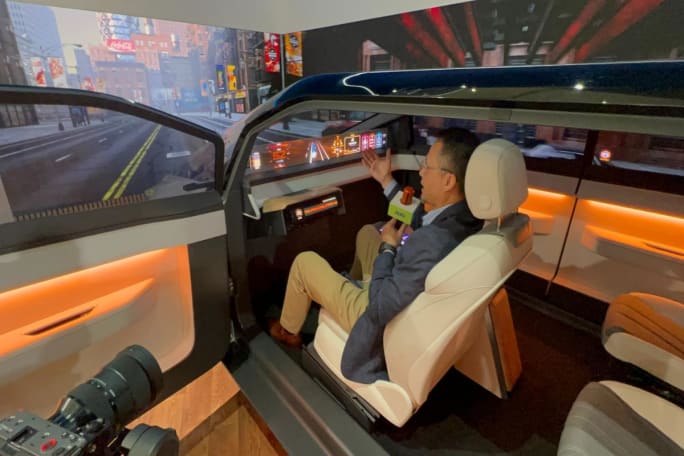 Man in vehicle cockpit describes computer display.