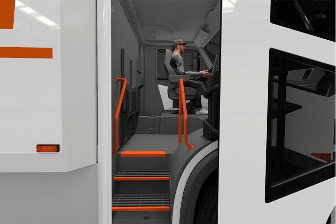 A computer-generated image shows a view into the cab of the truck, with driver seated behind the wheel, and an interior set of stairs.