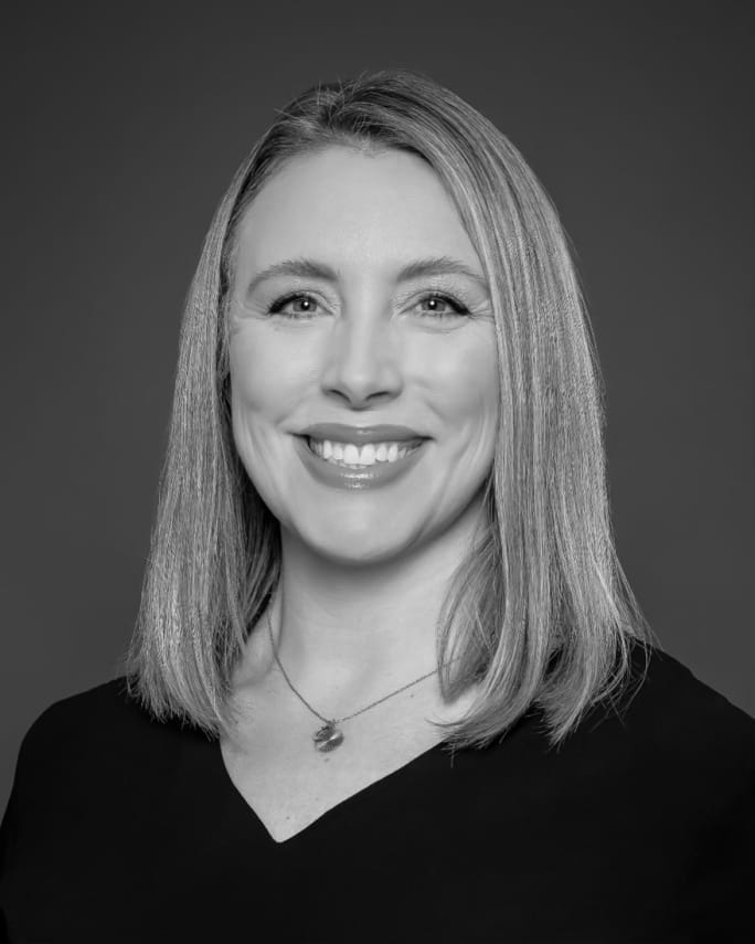 A smiling woman with blonde hair