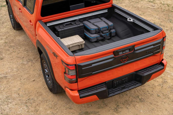 Overhead view of an orange Nissan Frontier's truck bed.