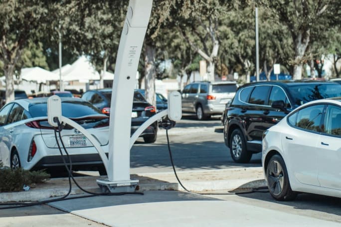 An outdoor shot of public charging units charging electric cars.