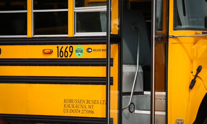 Up close view of the side of a propane autogas Blue Bird bus.