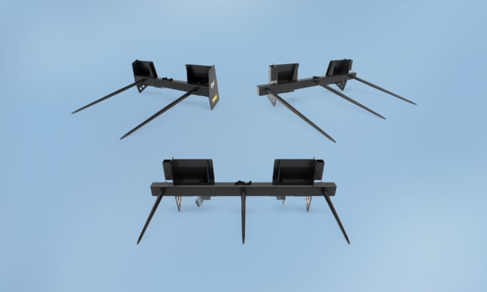 Bobcat bale spear attachment for lifting and moving round or square bales.