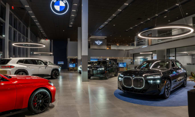 A BMW dealership showroom is pictured.