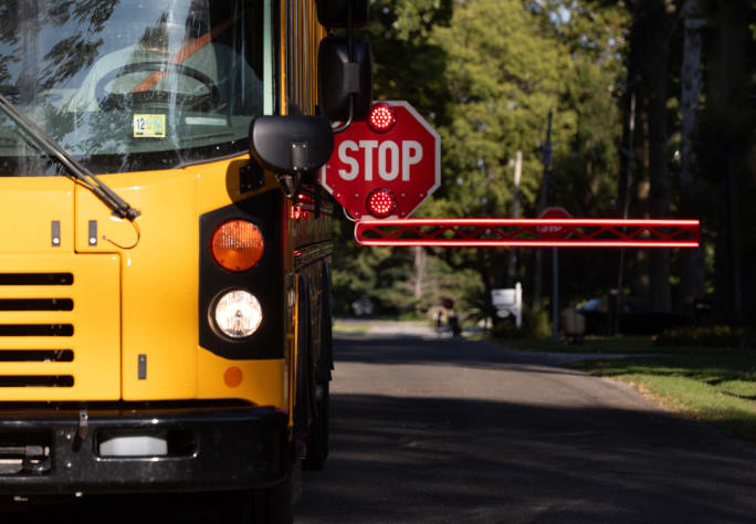 an extended stop arm on a school bus