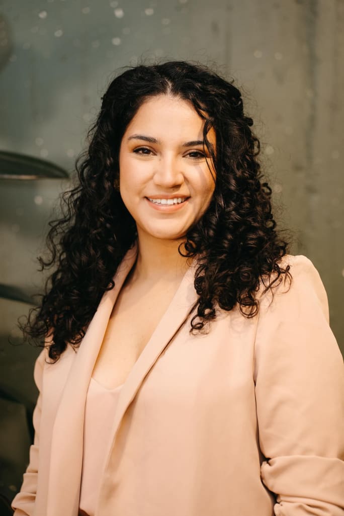 A smiling headshot of Carolina Cordoba