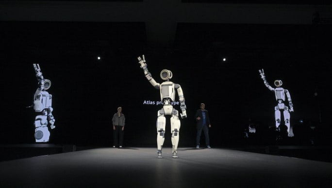 Atlas humanoid robot waves to crowd from stage at CES 2026