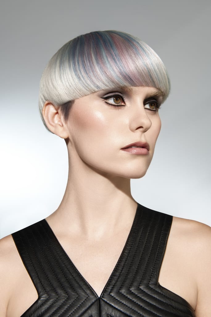 A woman with short white blonde hair