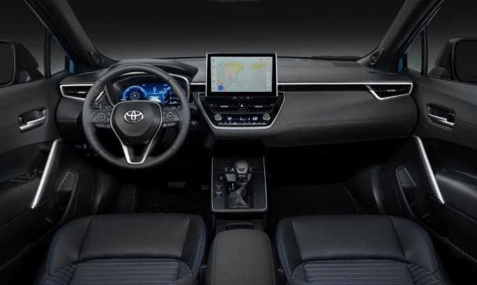 The interior dash and console of the new 2026 Toyota Corolla Cross.