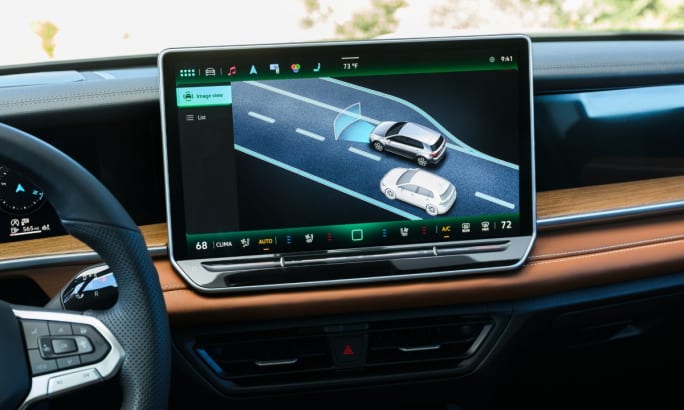 A 2025 Volkswagen Tiguan interior view of the infotainment screen showing safety features.