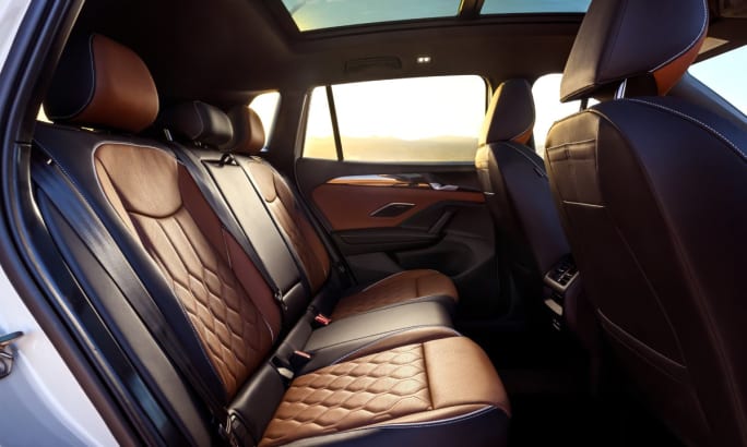 A 2025 Volkswagen Tiguan interior view of the back seat.