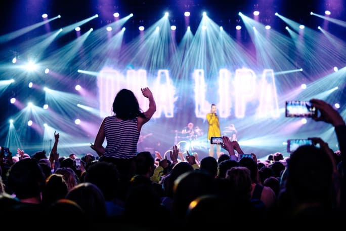 A concert photo of a stage and a crowd.