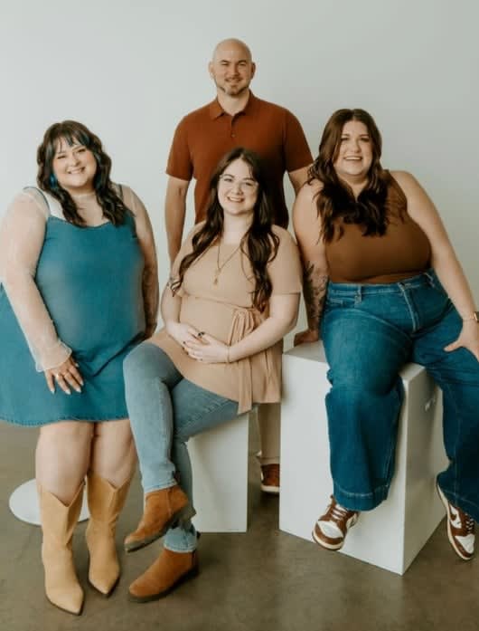 Smiling, the management team of 22 Changes and Ensemble Salon, including Kelleigh Strange, Darren Wood, Tasha, and Erin Kramer.