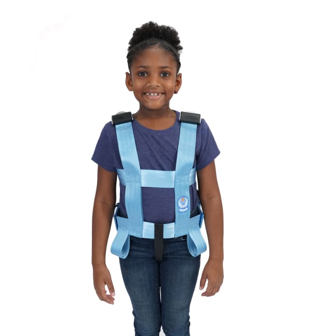 a child wearing a safety harness