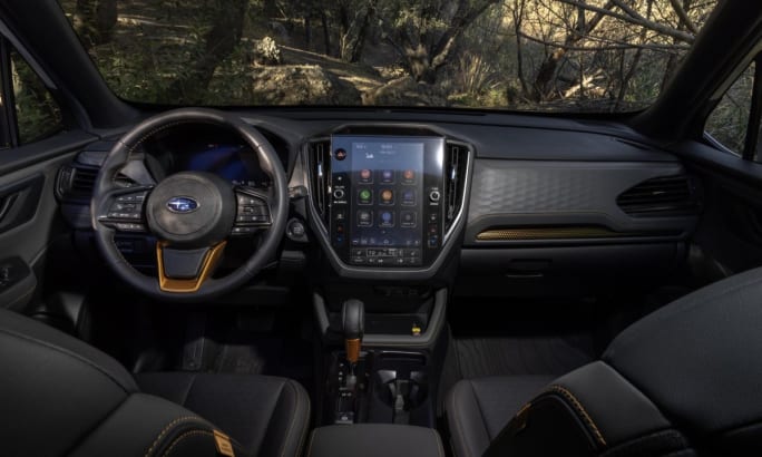 2026 Subaru Forester Wilderness front-cabin interior featuring front dashboard and drivers/passenger seats.