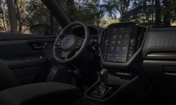 2025 Subaru Forester Hybrid front-cabin interior featuring the front dashboard and driver seat.