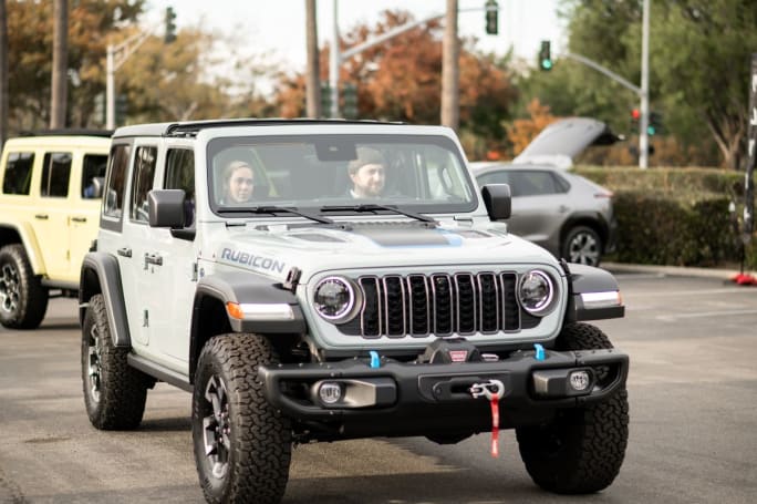 Ride and drive attendees driving a Jeep Wrangler. 