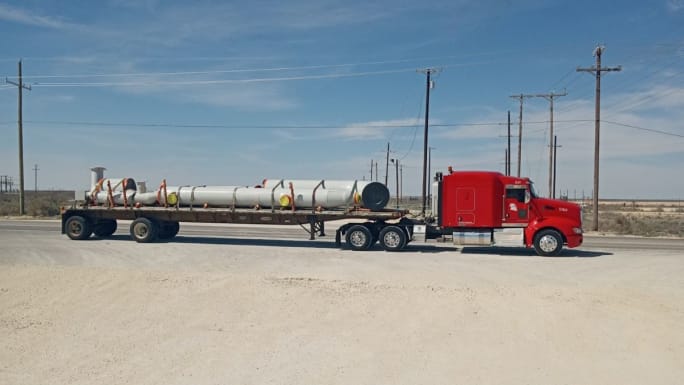Flucker flatbed tractor-trailer.