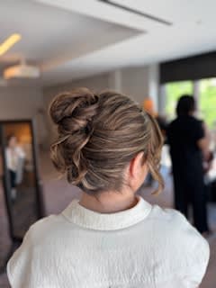 High and textured French twist bun.
