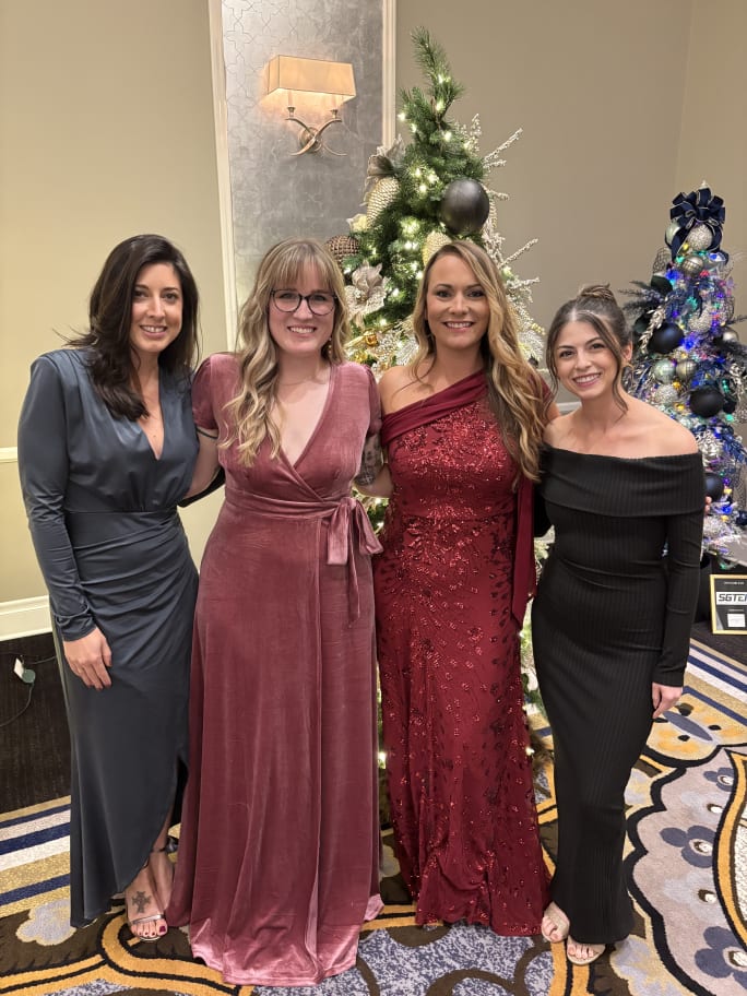 Team members from Revive Salon and Day Spa in formal attire.