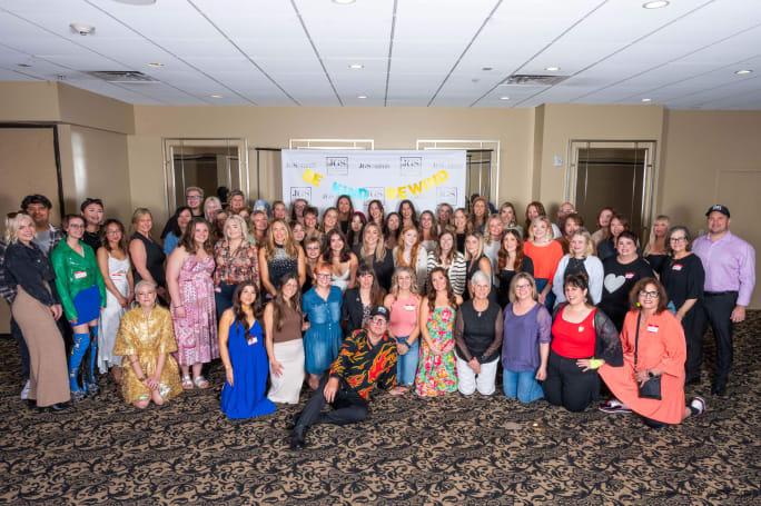 A large group of employees from James Griffith Salon pose at their annual Summit.