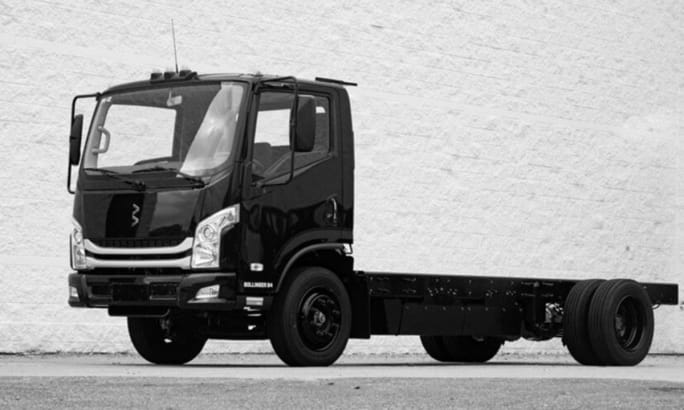 A black and white photo of a Bollinger Motors B4 EV Truck cab and chassis.