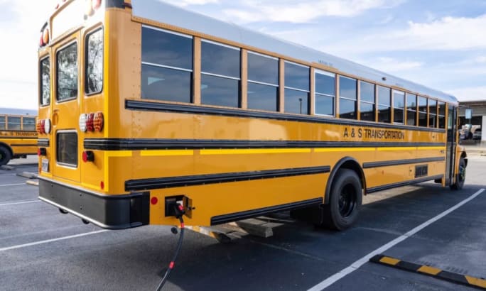 An IC Bus Type C electric school bus charging.