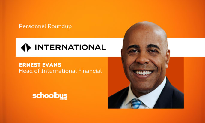 An orange and white graphic with a business portrait of Ernest Evans.