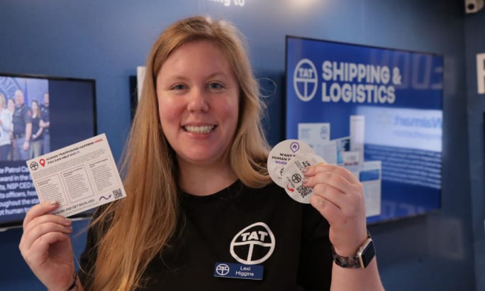 TAT Director of Industry Engagement Lexi Higgins poses with TAT materials.