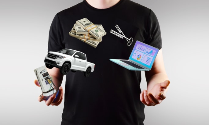 Man juggling money, a laptop, EV charging station, and a miniature service truck, illustrating the competing priorities of fleet management.
