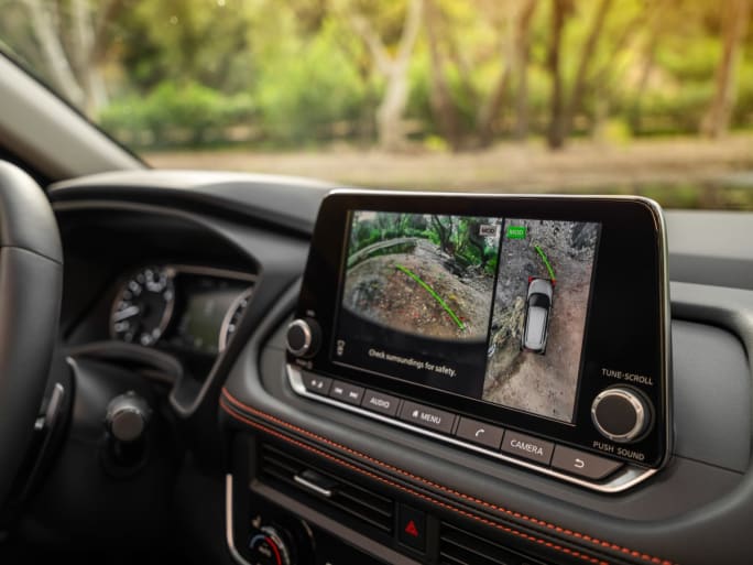 Close up of the dashboard monitor screen in a Nissan car.