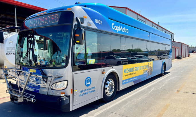 A gray and blue CapMetro automated bus.