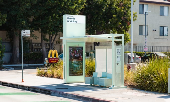 A Tolar bus shelter during the day.