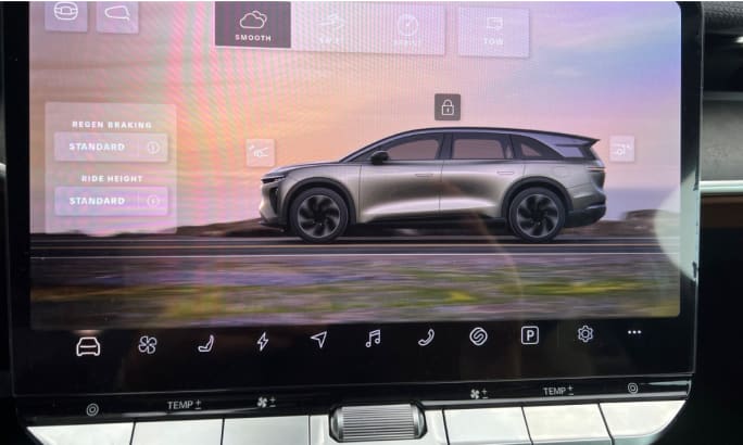 Dashboard display screen image of the Lucid Gravity surrounded by touchscreen control options.