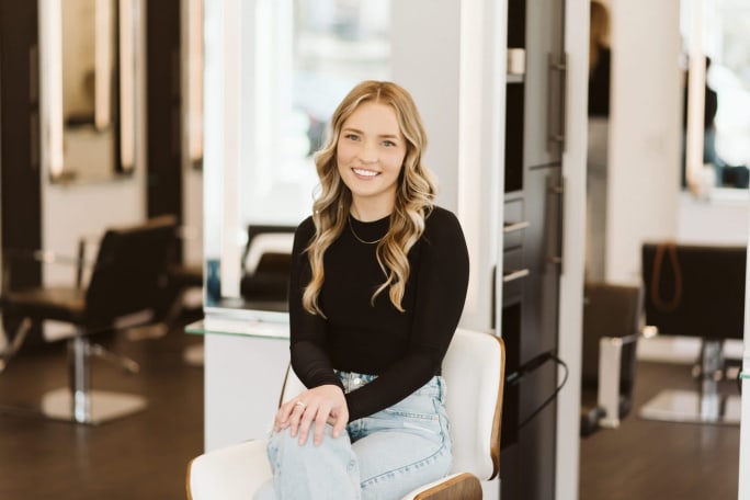 Salon Manaer Mallory Eithun sits at a station in Be Inspired Salon in Madison, Wisconsin