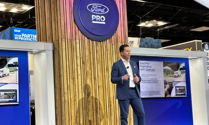 Matt Atkenson speaks on stage with Ford Pro branding.