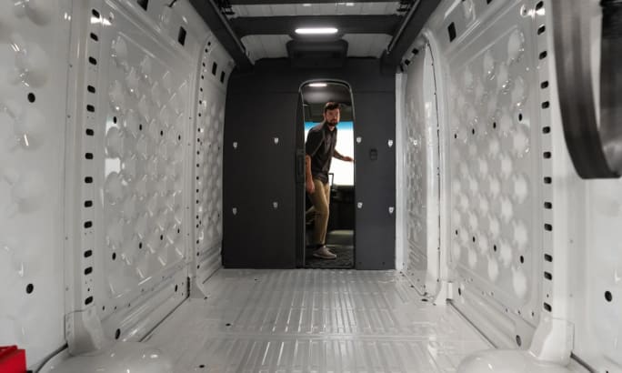 Full view of the back cargo space of a Rivian commercial van.