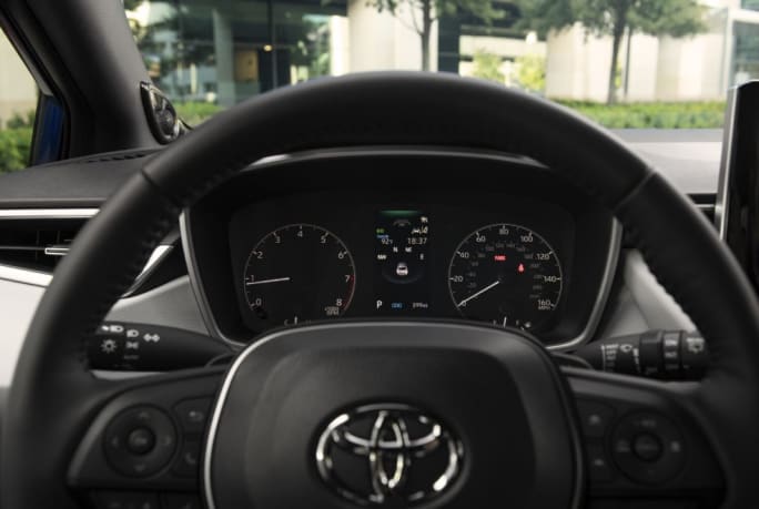 Steering wheel and dash of a 2025 Toyota Corolla Hatchback.