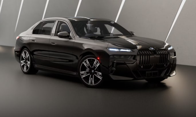 A black 2025 BMW i7 in a gray showroom.