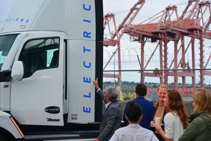 People check out an electric Kenworth truck at a Northwest Seaport Alliance event.
