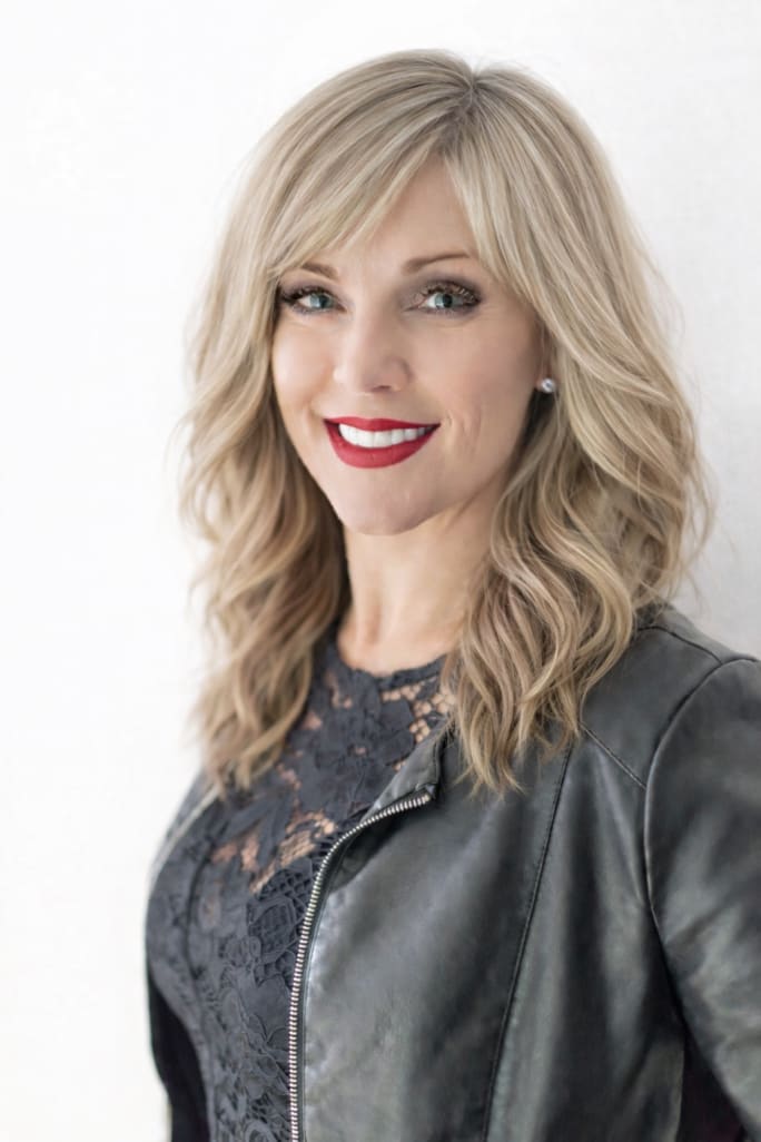 Natasha MacDonald, the Rusk Global Education Director, smiling, wearing black.
