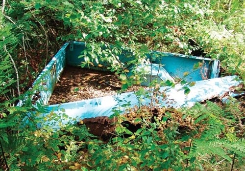 The murder weapon was found under this abandoned truck body.