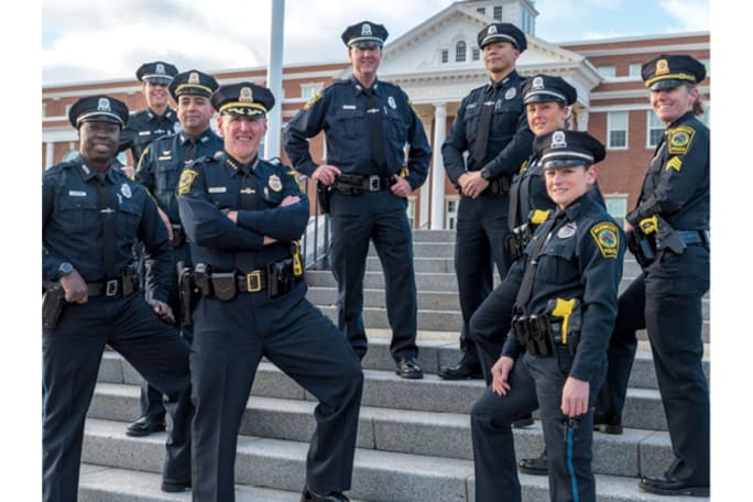 Chief Bill Brooks of the Norwood (MA) Police Department with some of his command staff. In an effort to prevent duty weapons from being stolen and used in crimes, the department now issues gun safes to its recruits. (Photo: Norwood PD)[|CREDIT|]