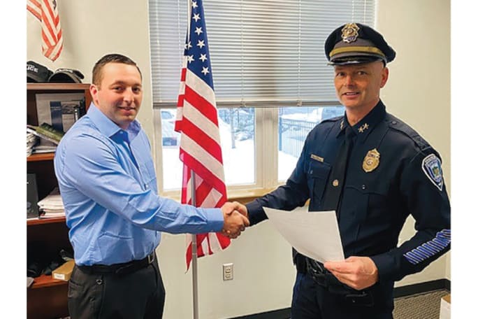 Sanford, ME, Police Chief Craig Andersen swears in a new officer. Andersen is an advocate of decentralized command that he says empowers his troops. (Photo: Sanford PD)[|CREDIT|]