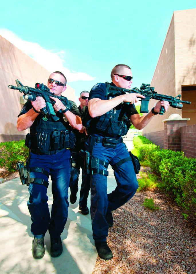 In 1997 LAPD officers shot it out with bank robbers in armor and carrying automatic rifles. The officers' handguns and shotguns were not up to the task. Now agencies issue rifles. [|CREDIT|]Photo: POLICE File