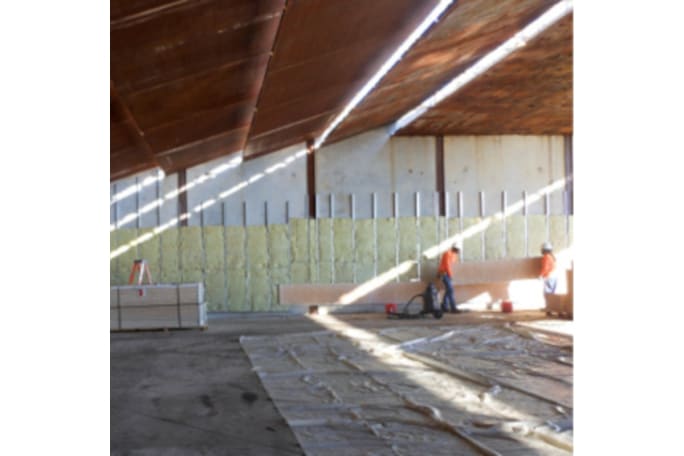 Installing the Troy Acoustics system to the walls of a range. The system absorbs noise and reduces the time that the sound of gunfire reflects on the range down to 1.5 seconds.[|CREDIT|]